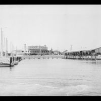 Photograph of Houston Yacht Club harbor and clubhouse after remodeling, view from water